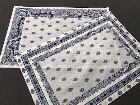 blue and white coated placemats with contrasting border